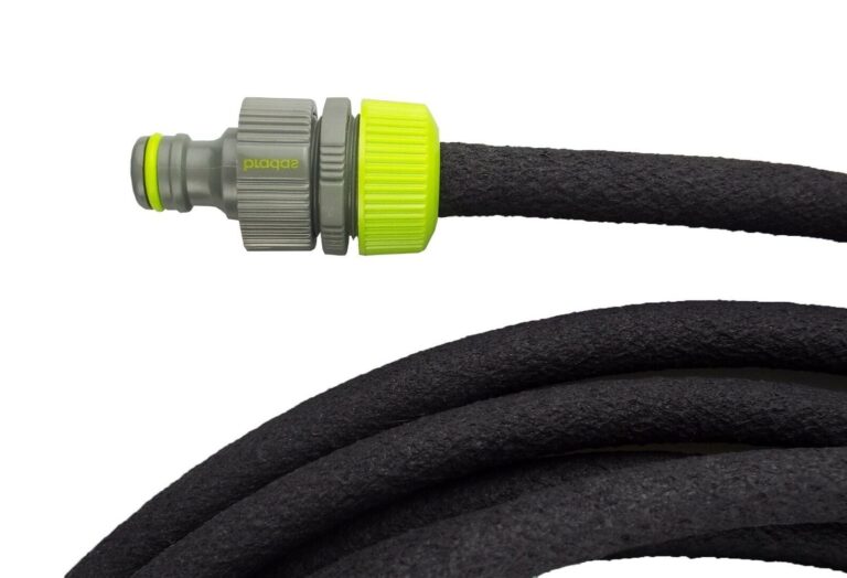 Grey and lime-green male quick connector attached to a black porous hose, with coiled hose below