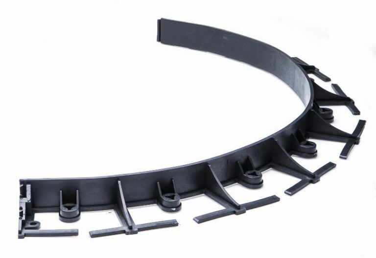 Black flexible lawn edging shaped into a curve, showing its horizontal fixing bases