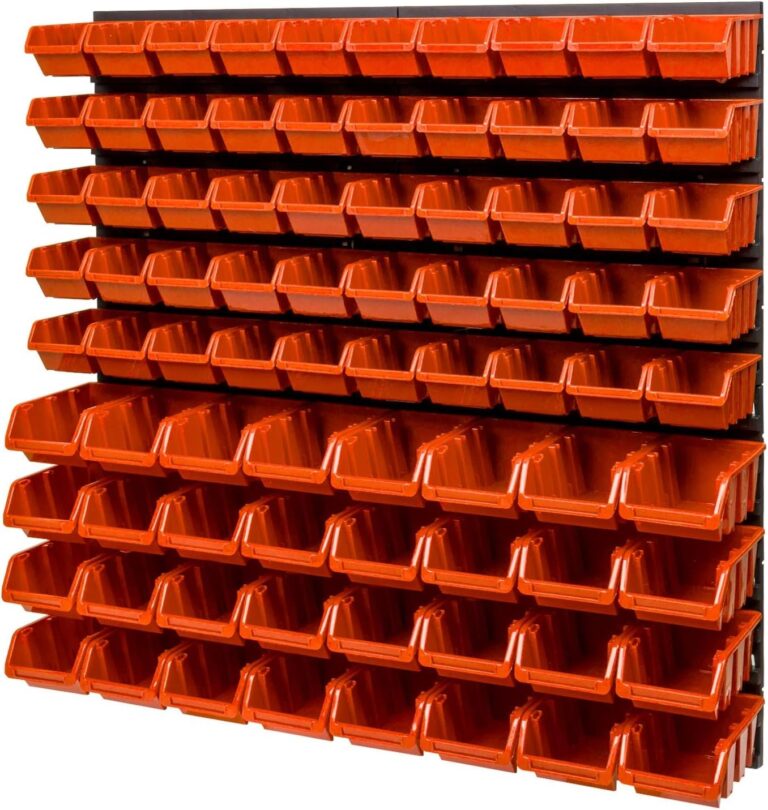 Black wall pegboard covered with rows of red storage bins in two sizes