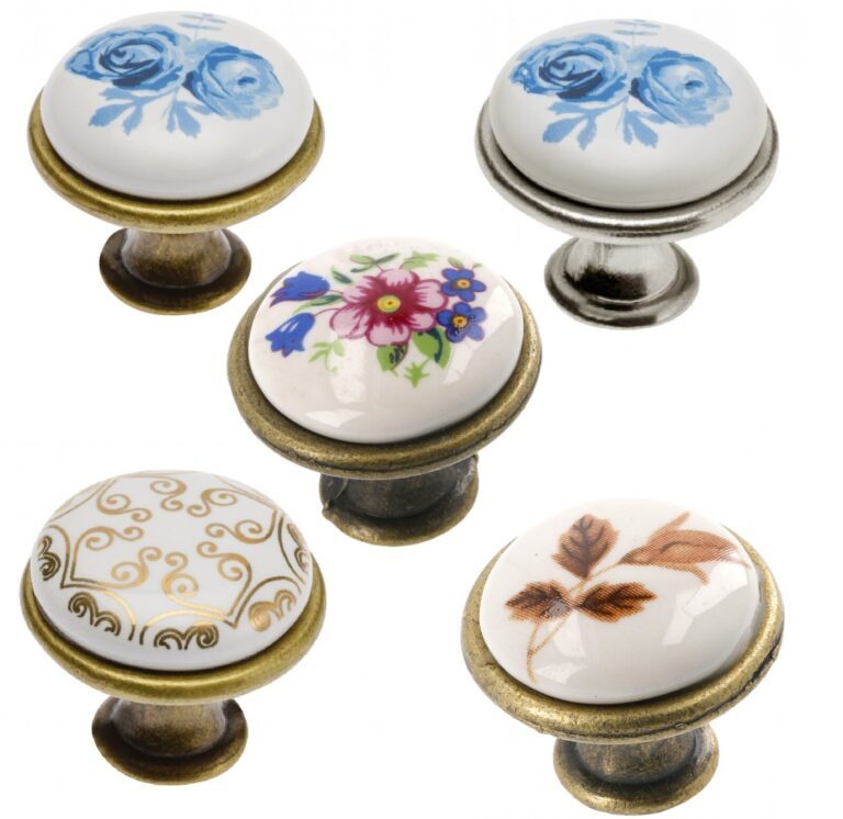 Porcelain cabinet knobs with floral and scroll patterns on brass- and silver-coloured bases