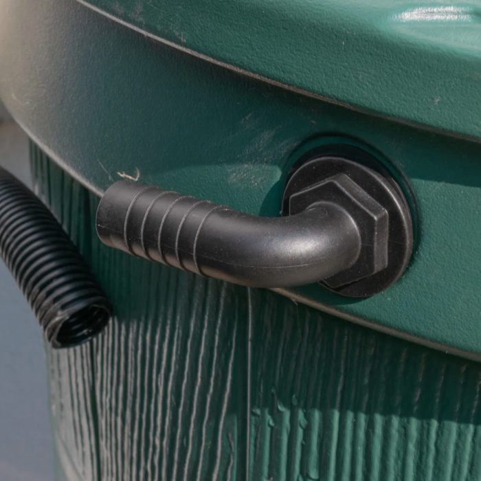 Black 90-degree hose-tail connector fitted through the side of a green water butt