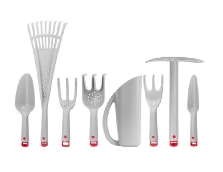 Set of eight grey garden hand tools with red handle ends, arranged in a row