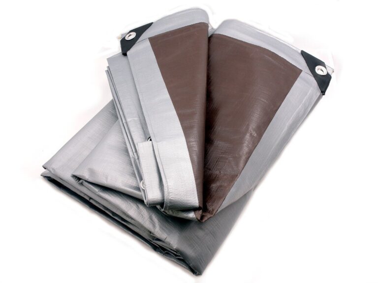 Folded tarpaulin with grey edging, black reinforced corners and metal eyelets